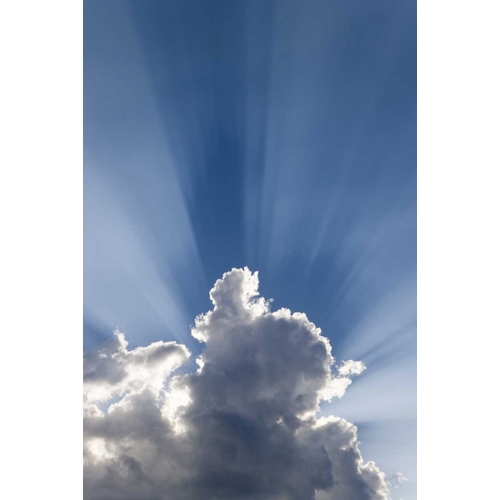 Crepuscular or Gods rays streak past cloud